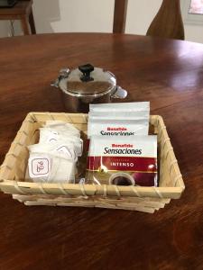 a wooden tray with books on a wooden table at Alojamiento en catamarca in San Isidro