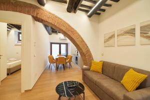 a living room with a couch and a table at AM13 - Design retreat in Perugia