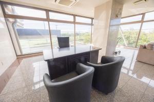 a living room with two chairs and a desk at JUN RESORT HOTEL - Vacation STAY 03681v in Hasunuma
