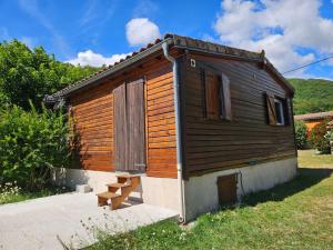 a small cabin with a bench in front of it at chalet in Thueyts