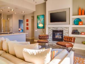 a living room with a couch and a fireplace at Sun Haven Escape by ACME House Company in Palm Springs +42 photos