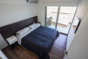 Ένα ή περισσότερα κρεβάτια σε δωμάτιο στο Palermo & Spa +36 φωτογραφίες