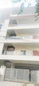 a white building with balconies on the side of it at Vaarahi Enclave Kondapur in Hyderabad