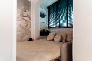 Ένα ή περισσότερα κρεβάτια σε δωμάτιο στο Apartament Alchemia Gór