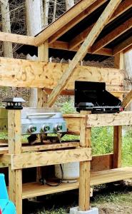 a picnic table with a grill and a stove at Sky Nest Glamp-Unplug-Reconnect in Red Bay