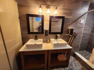 a bathroom with two sinks and a mirror and a tub at Sky Nest Glamp-Unplug-Reconnect in Red Bay +56 photos