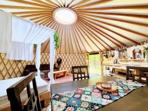 a room with a tent with a table and a sink at Dreaming SkyLake Yurt Waterfront in Red Bay