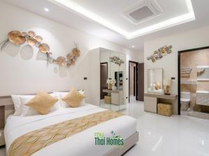 Ένα ή περισσότερα κρεβάτια σε δωμάτιο στο St George's Park Hauhin