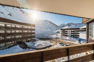 a building with a mural of a mountain at Résidence Roches Rouges A - Charmant, chaleureux, pied des pistes MAE-3749 in Tignes +11 photos