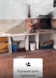 a bathroom with a sink in a room at Duplex santa Teresita para 6 personas in Santa Teresita