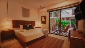 Giường trong phòng chung tại SmartDepas Tulum +98 ảnh