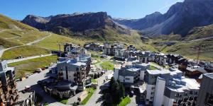 an aerial view of a city in the mountains at Résidence Curling A - Par dessus les toits, vue Grande Motte MAE-1164 in Tignes