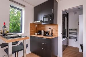 Η κουζίνα ή μικρή κουζίνα στο Cosy'N'Spa - Tinyhouse - Parking, Hypercentre,Gare