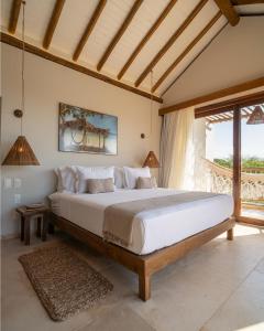 Una cama o camas en una habitación de Villa Tapi