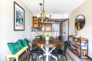 a dining room with a table and chairs at Alpine Oasis at Alpine Village in Canmore