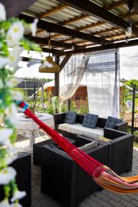 a red hammock in the middle of a patio at Ostoja Czersk Zamek Góra Kalwaria in Czersk