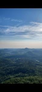 an aerial view of a field of trees and mountains at Jurte für naturliebhaber in Dernbach