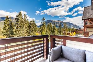 a balcony with a view of the mountains at Creekside at Rundle Cliffs Lodge in Canmore