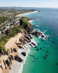 an aerial view of a beach and the ocean at Sea Salt One Burgess Beach in Forster