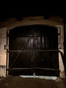 an old wooden door in a building with a brick floor at Kalmar City in Kalmar