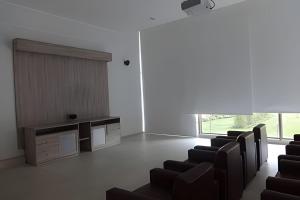 a waiting room with chairs and a table and a window at Exclusive and Secure Apartment Parque Arauco Las Condes in Santiago +90 photos