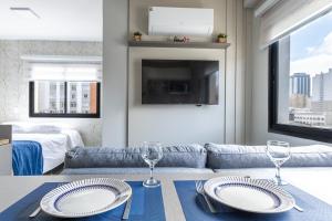 Ένα ή περισσότερα κρεβάτια σε δωμάτιο στο Moderno e Novíssimo Região Central com Academia e Coworking