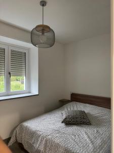 Postel nebo postele na pokoji v ubytování Petite Maison Aurora