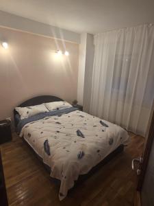 Postel nebo postele na pokoji v ubytování Apartament Matei