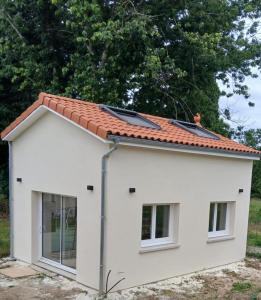 a white house with solar panels on the roof at casa martinez in Artigues-près-Bordeaux +6 photos