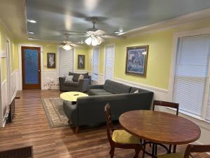 a living room with a couch and a table at 2br 2ba Close to Downtown, Midtown, and FSU in Tallahassee