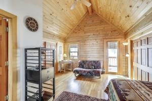 a room with a bed and a chair and a clock at Beautiful Peak 7 Private Home in Breckenridge