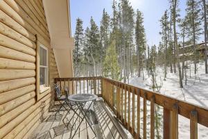 a wooden balcony with a table and chairs on it at Beautiful Peak 7 Private Home in Breckenridge