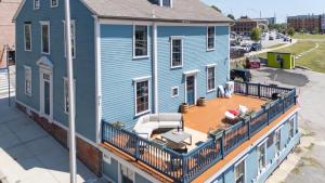 an aerial view of a blue house with a deck at The Hill in Providence