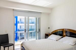 Postel nebo postele na pokoji v ubytování Arenas del Mar Apartments