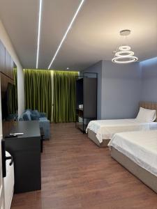 Postel nebo postele na pokoji v ubytování Hotel Muja