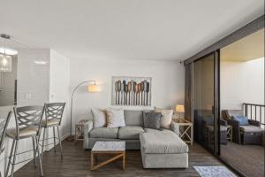 a living room with a couch and a table at SUGAR BEACH RESORT, #421 condo in Kihei