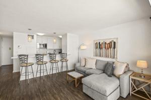 a living room with a couch and chairs and a kitchen at SUGAR BEACH RESORT, #421 condo in Kihei