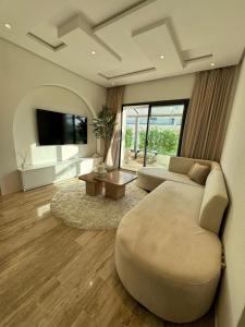 Televisyen dan/atau pusat hiburan di Luxe moderne gezin appartement