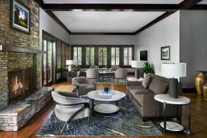 a living room with a couch and a fireplace at Montgomery Marriott Prattville Hotel & Conf Ctr at Capitol Hill in Prattville