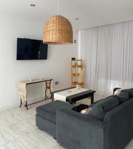 a living room with a couch and a table at Casa de Marianela in Chajarí
