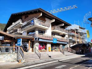a building under construction on a street at Résidence Cry De Lys - Appartement centre station, proche des pistes MAE-8471 in Les Gets