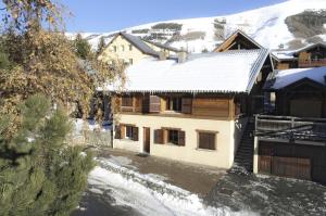 a house with snow on the roof of it at Résidence Alexandre & Chartreuse - CHALET CHARTREUSE MAE-9581 in Vénosc