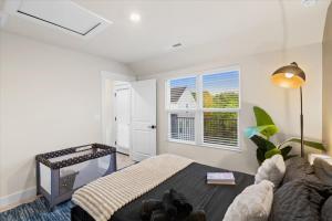a living room with a couch and a tv at Luxe King 3BR Townhouse Mins to Uptown CLT in Charlotte