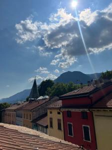 a view of the roofs of buildings in a city at B&B Tower Suite Trento in Trento