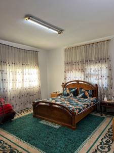 Ένα ή περισσότερα κρεβάτια σε δωμάτιο στο Abuawad Rental