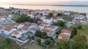 an aerial view of a small town next to the water at Apartments Vjeko in Nin