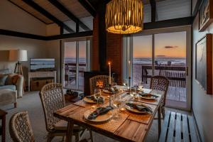 a dining room with a table with a view of the ocean at Family Tides in Ventura +31 photos