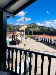 a view of a town from a balcony at Posada Refugio Colonial in Cucunubá +34 photos
