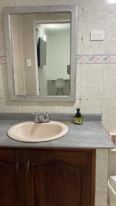 a bathroom counter with a sink and a mirror at Habitación independiente cerca al aeropuerto # 5 in Cartagena de Indias