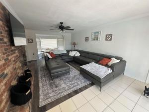 a living room with a couch and a chair at 5 Bedroom 4 Bathroom Pool Gym Leesburg Retreat in Leesburg